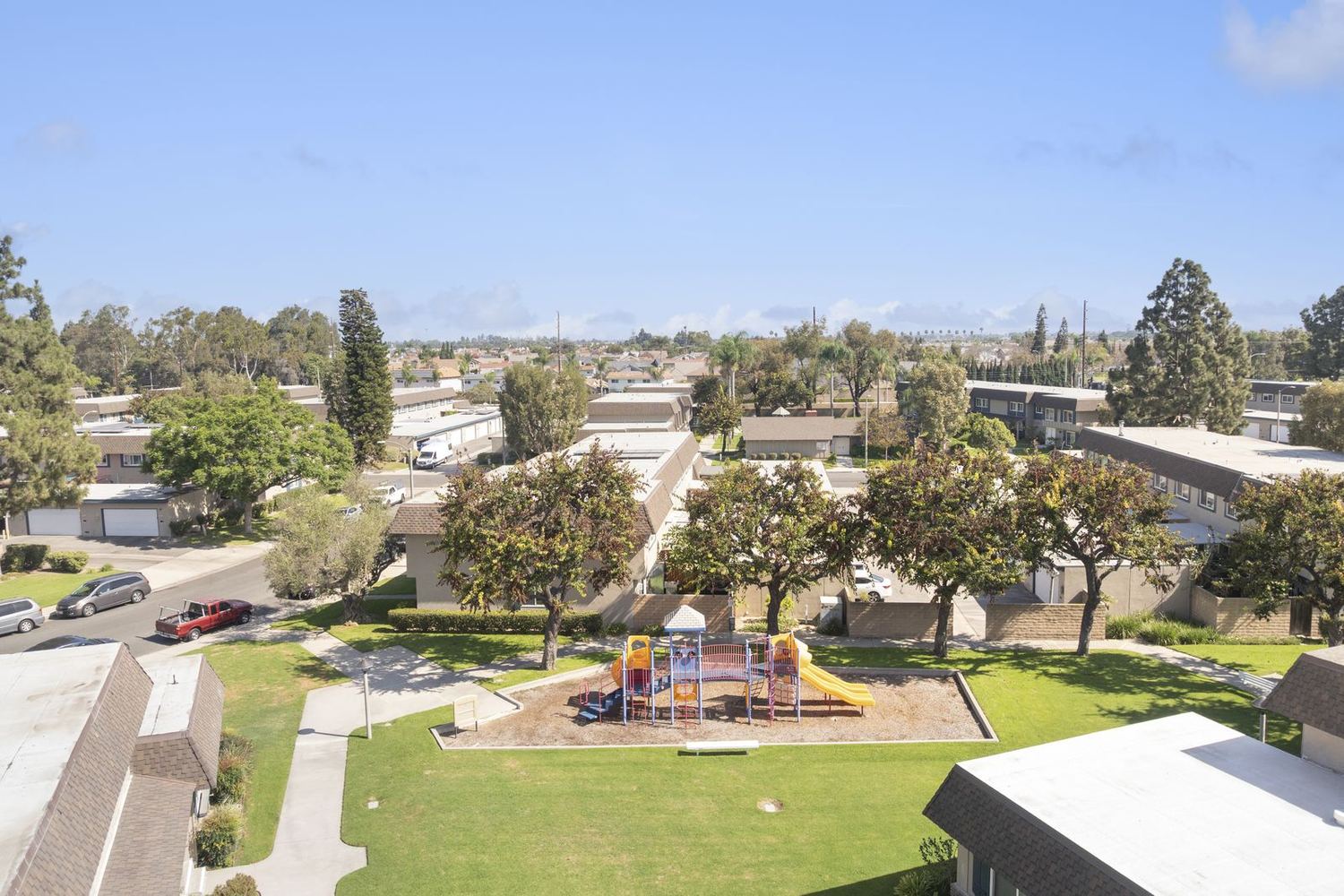 Aerial view of Cypress Tanglewood showing rows of townhomes, mature trees and greenbelts