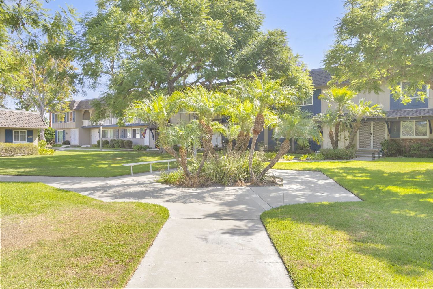 Open lawn and walking paths between the homes at Cypress Tanglewood